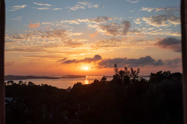 Sunset view through the villa window over the Mediterranean