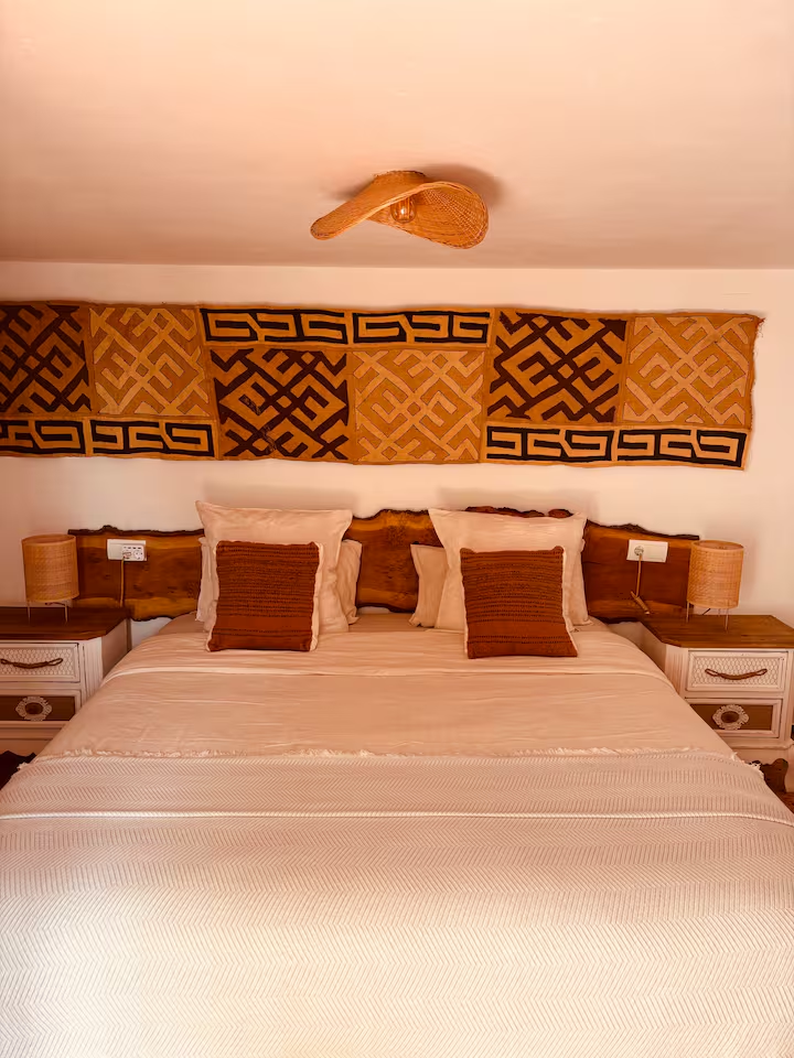 Double bedroom with Kuba cloth wall hanging